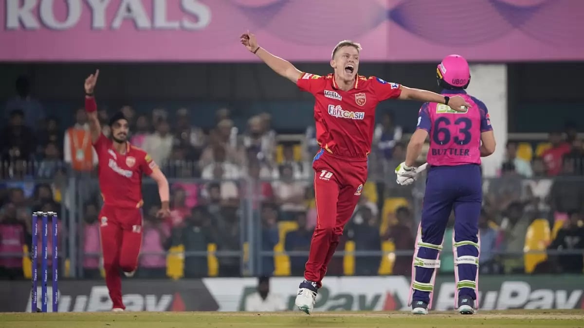 Nathan Ellis celebrates the wicket of Jos Buttler in Guwahati on Wednesday.