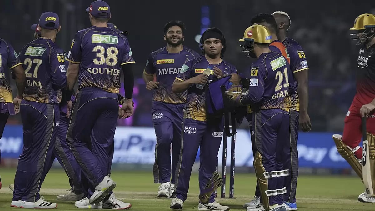 Suyash Sharma (C) is congratulated by teammates for the dismissal of Dinesh Karthik.