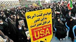 Echoing the Supreme Leader: Veiled Iranian women at a pro-government protest rally in opposition to