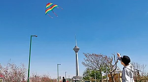 Life In Iran: A kite in the sky during Sizdah Bedar, also known as Nature’s Day in Tehran, April 202