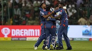 LSG players celebrate their team's win in Bengaluru on Monday.