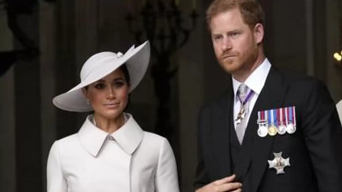 Prince Harry with wife Meghan Markle