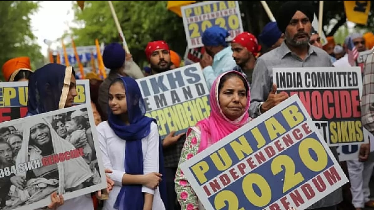 Sikh community hold signs calling for a separate state of Khalistan to be created in India