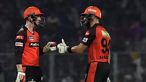 Markram, right, congratulates Brook on reaching his fifty at the Eden Gardens on Friday.