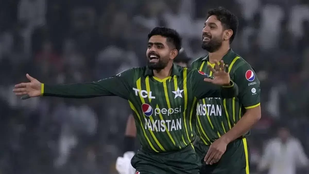 Pakistan's Babar Azam, center, Haris Rauf celebrate a wicket during the 1st T20I.
