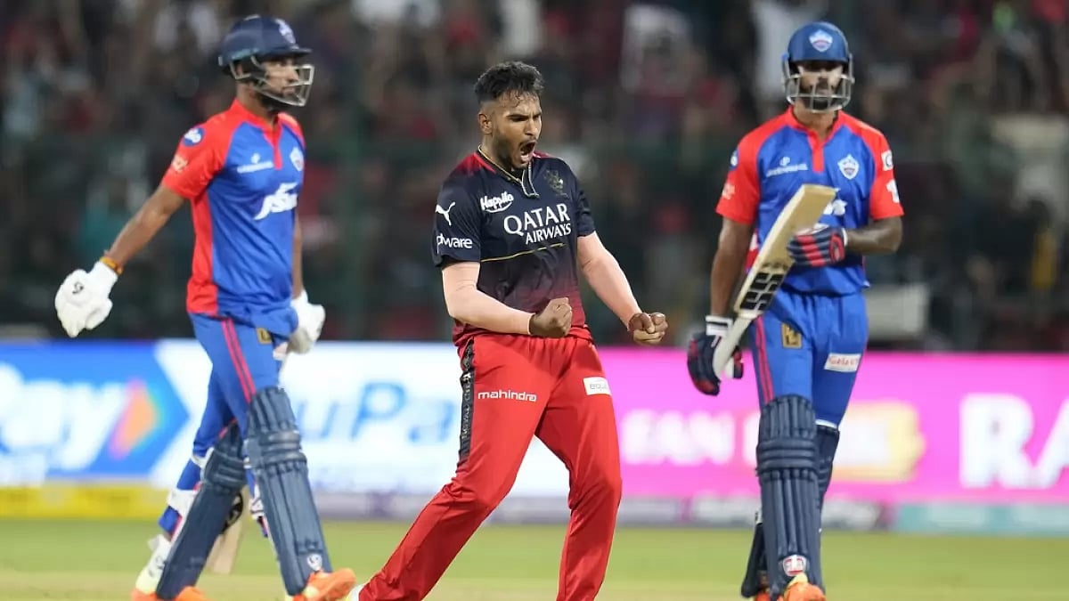 Vyshak, centre, celebrates the wicket of Lalit Yadav in Bengaluru on Saturday.