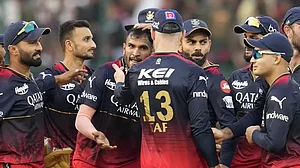 Vyshak, centre, is congratulated by his team-mates after dismissing David Warner on Saturday.