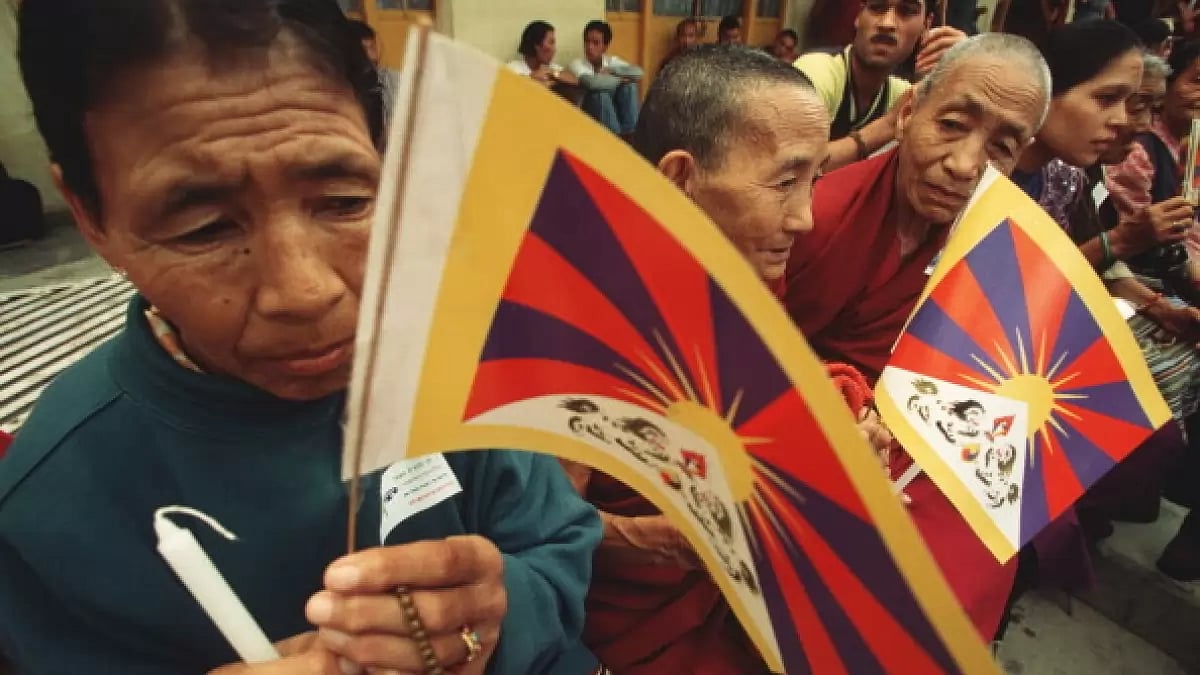 Tibetan Buddhists with Tibet flag