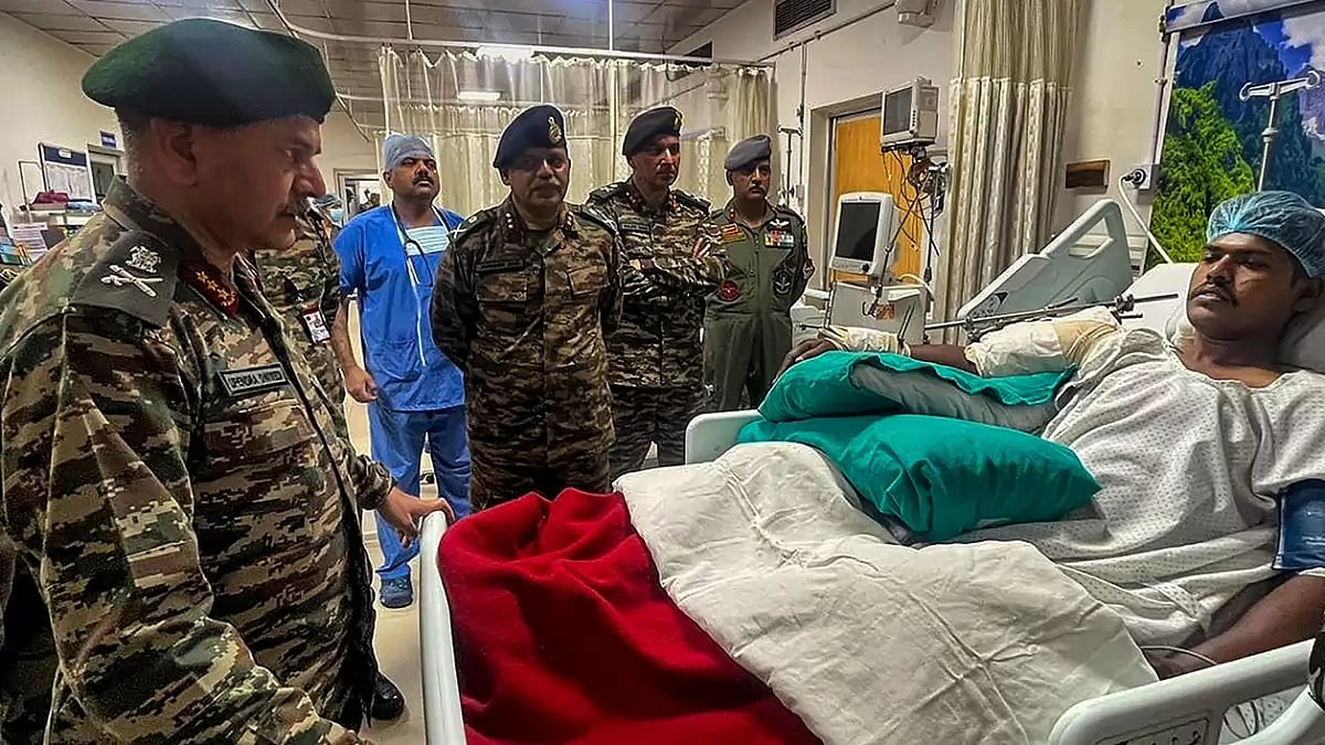 Army Commander Northern Command Lt General Upendra Dwivedi meets a survivor of the terror attack 