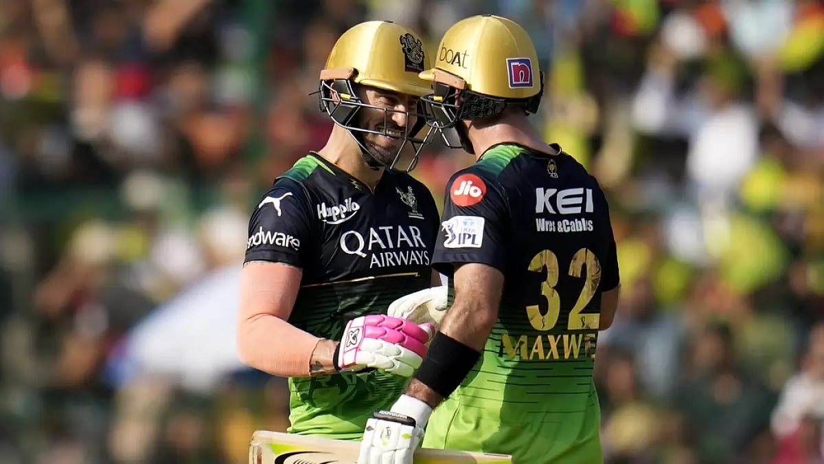 Du Plessis and Maxwell celebrate after reaching their 100-run partnership in Bengaluru on Sunday.