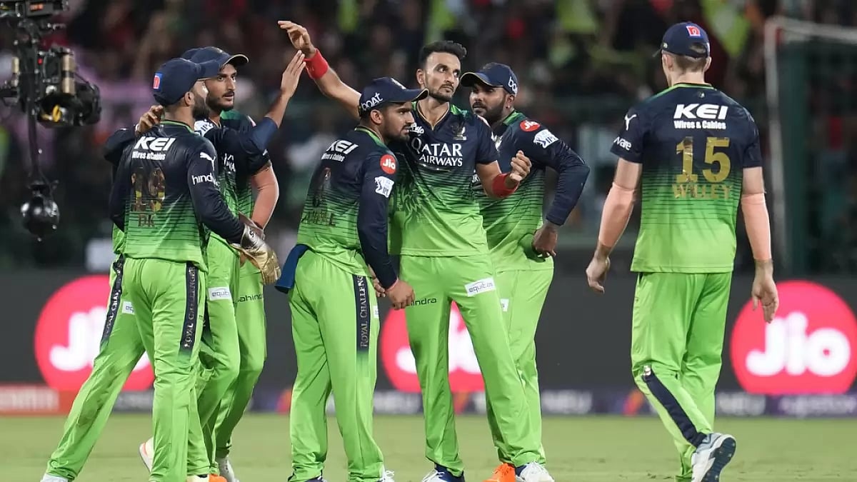 RCB players celebrate the wicket of Sanju Samson in Bengaluru on Sunday.