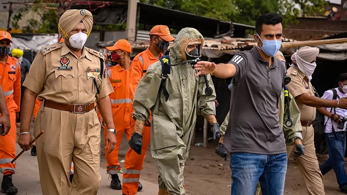 NDRF and police personnel at the site after a gas leak incident in the Giaspura area, in Punjab's Ludhiana