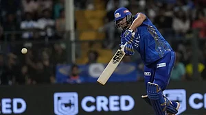 Tim David bats during his unbeaten innings of 45 runs from 14 balls in Mumbai on Sunday.