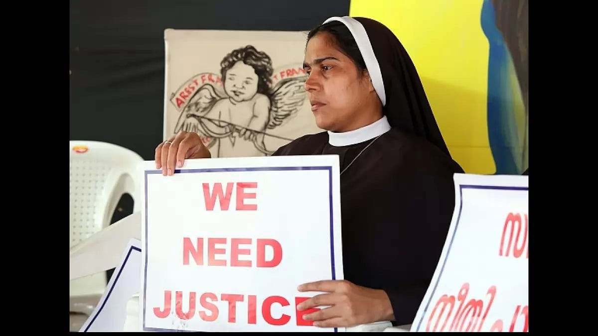 Nuns hold placards during a protest demanding justice after an alleged sexual assault in Kochi