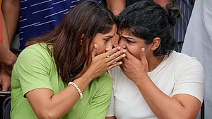 Vinesh Phogat, left, and Sakshi Malik pictured during their protest against WFI chief in New Delhi.