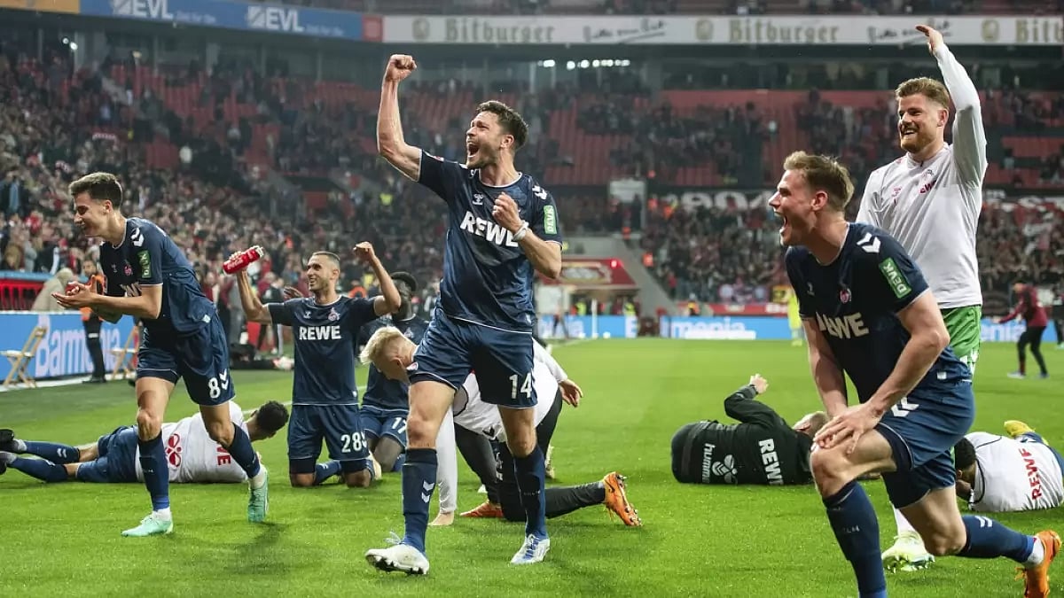 Cologne players celebrate after the final whistle against Leverkusen on Friday.