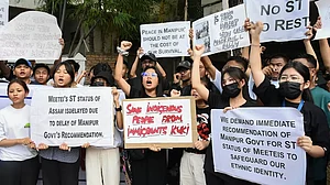 People from Manipur raise slogans during their protest against the ongoing violence in the state
