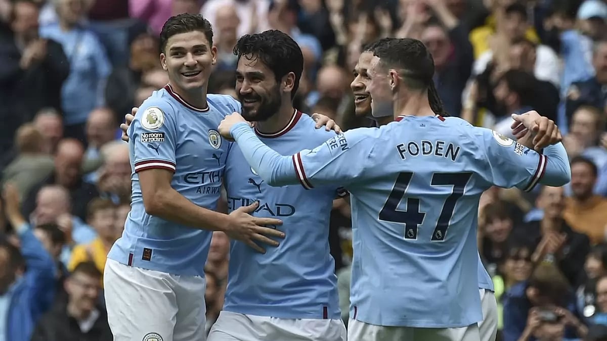 Gundogan, centre, celebrates after scoring his team's second goal against Leeds on Saturday.
