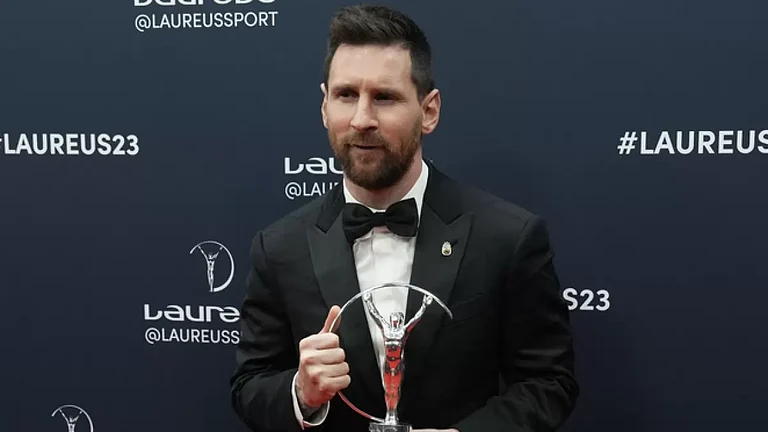 Lionel Messi poses after he was presented the award for sportsperson of the year. - null