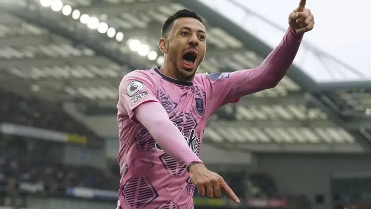 Dwight McNeil celebrates after scoring for Everton against Brighton.