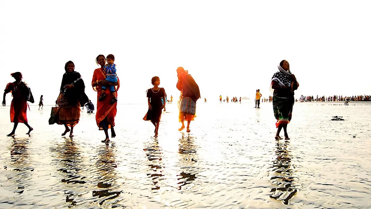 Women and children walking along the beach (Representational Image)