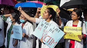 Doctors and medical students raise slogans during their protest against the killing of a female doctor, outside Kerala Secretariat in Thiruvananthapuram.