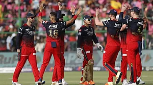RCB players celebrate the wicket of RR's Yashasvi Jaiswal in Jaipur on Sunday.