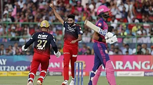 Mohammed Siraj of RCB celebrates the wicket of Devdutt Padikkal on Sunday.