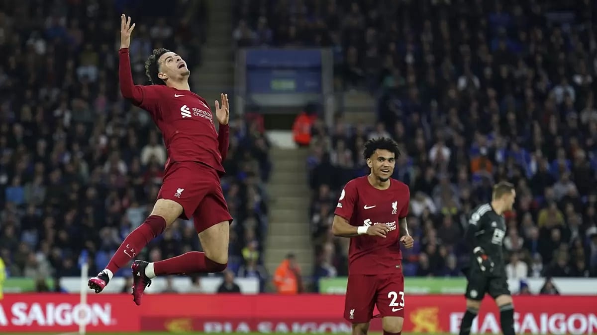 Curtis Jones, left, celebrates after scoring a goal against Leicester on Monday.