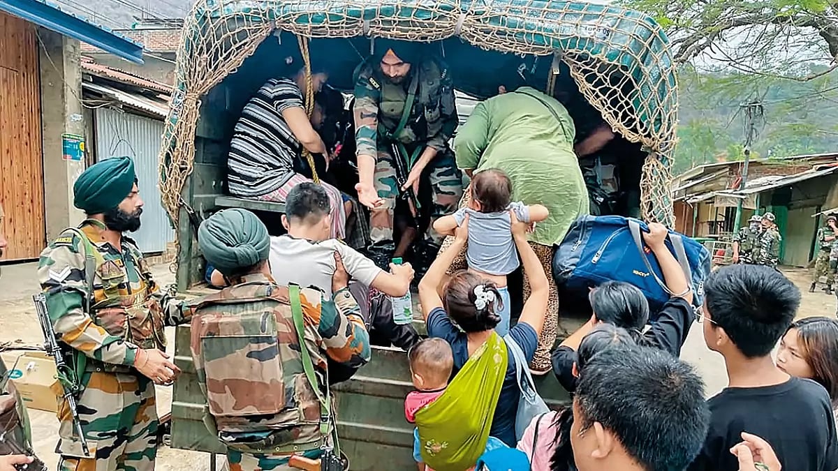 Chaos and Confusion: Army personnel rescue people from a violence-hit area in Manipur