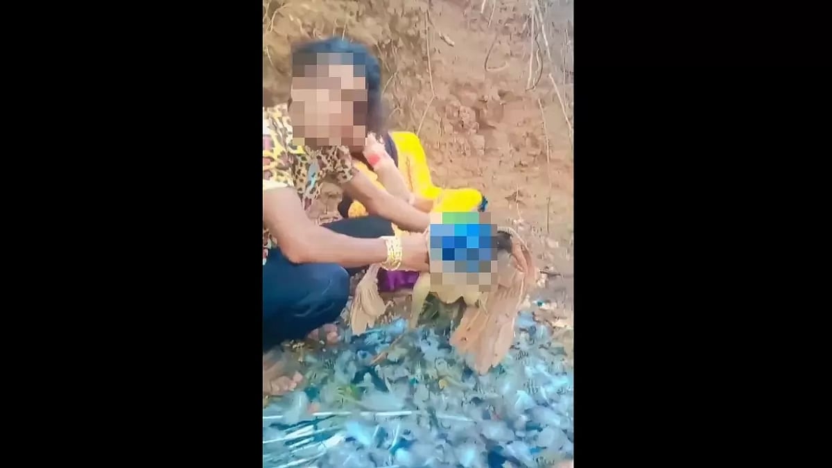 Screengrab of video of MP man picking peacock feathers