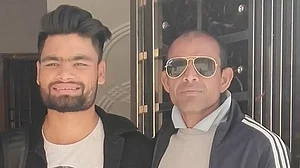 Rinku Singh with coach Masood Uz Zafar Amini.
