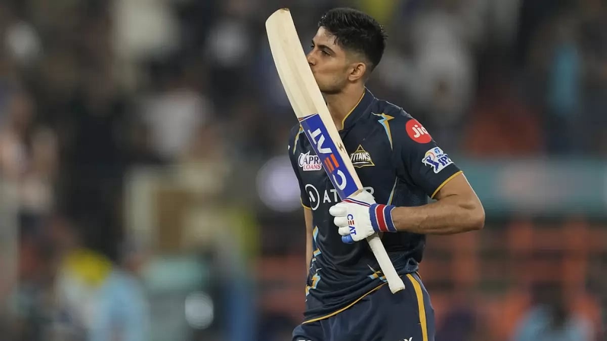 Shubman Gill kisses his bat after reaching his hundred against MI on Friday.