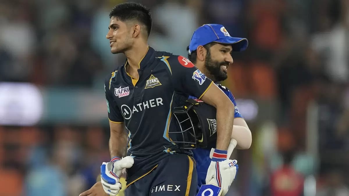 Gill is congratulated by Rohit Sharma after reaching his hundred on Friday.