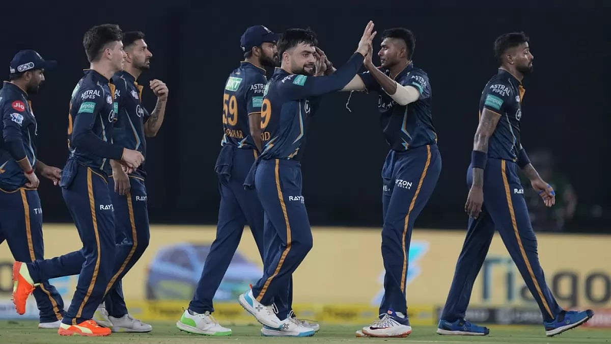 GT players celebrate the wicket of Tilak Varma in Ahmedabad on Friday.