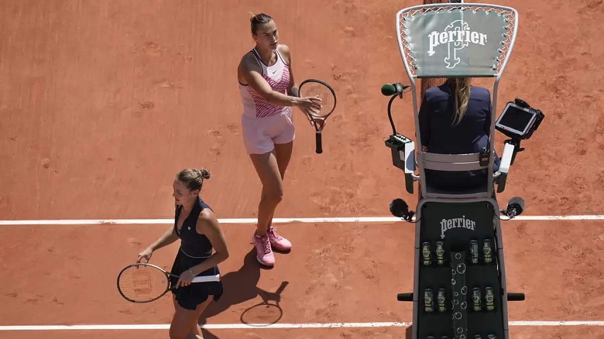 Kostyuk pictured walking past Sabalenka after their first round match on Sunday.