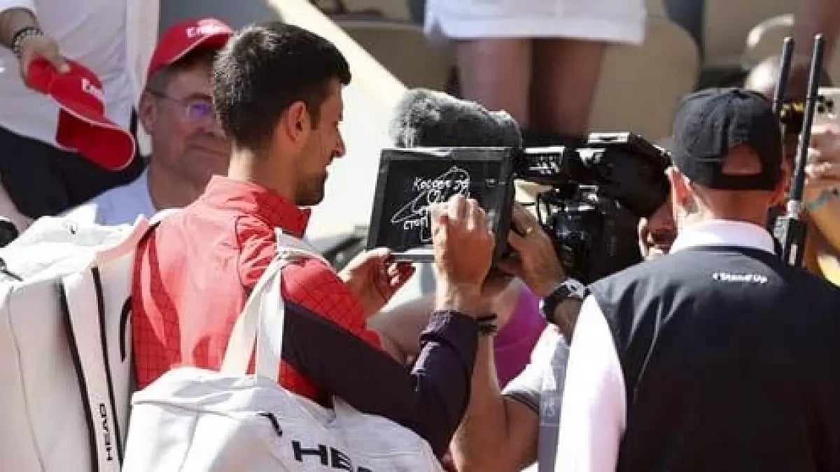 Djokovic wrote 'Kosovo is the heart of Serbia. Stop the violence.' in Serbian on the camera lens.
