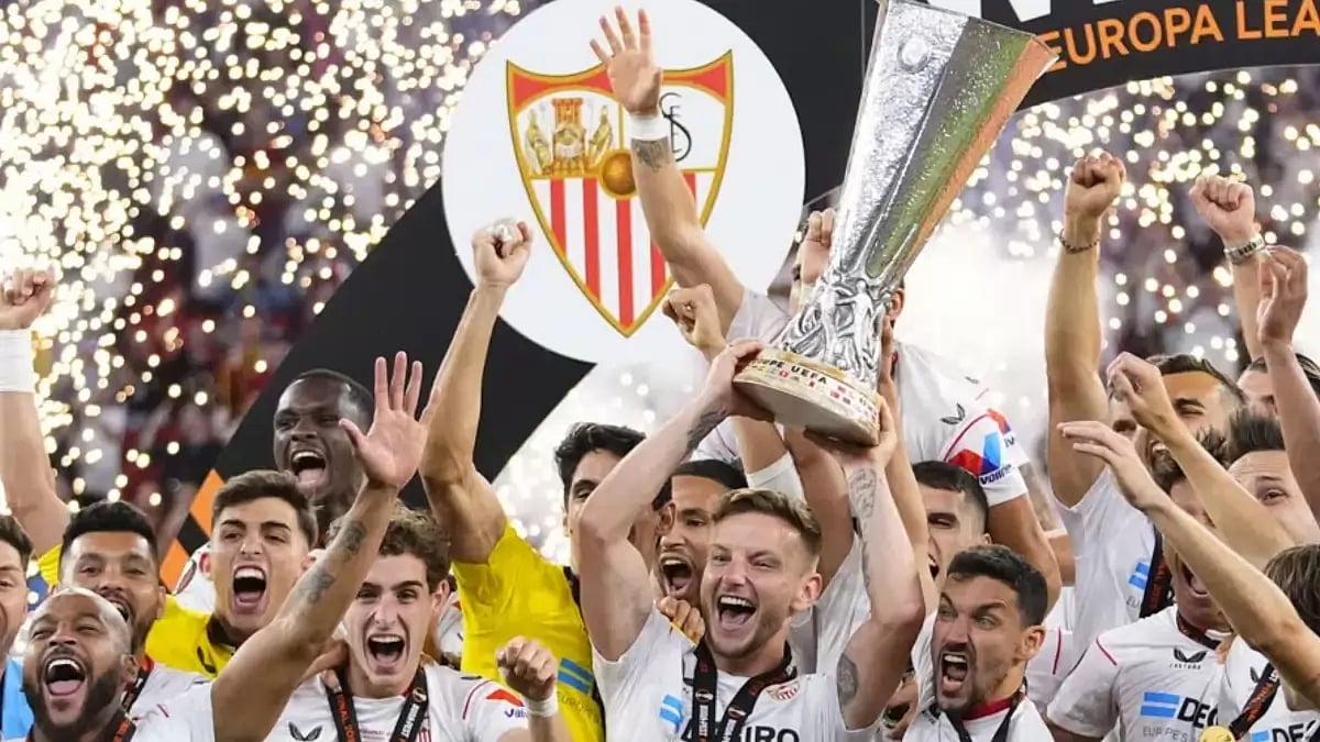 Sevilla players lift the trophy after winning the Europa League final against Roma.