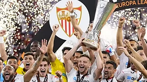 Sevilla players lift the trophy after winning the Europa League final against Roma.