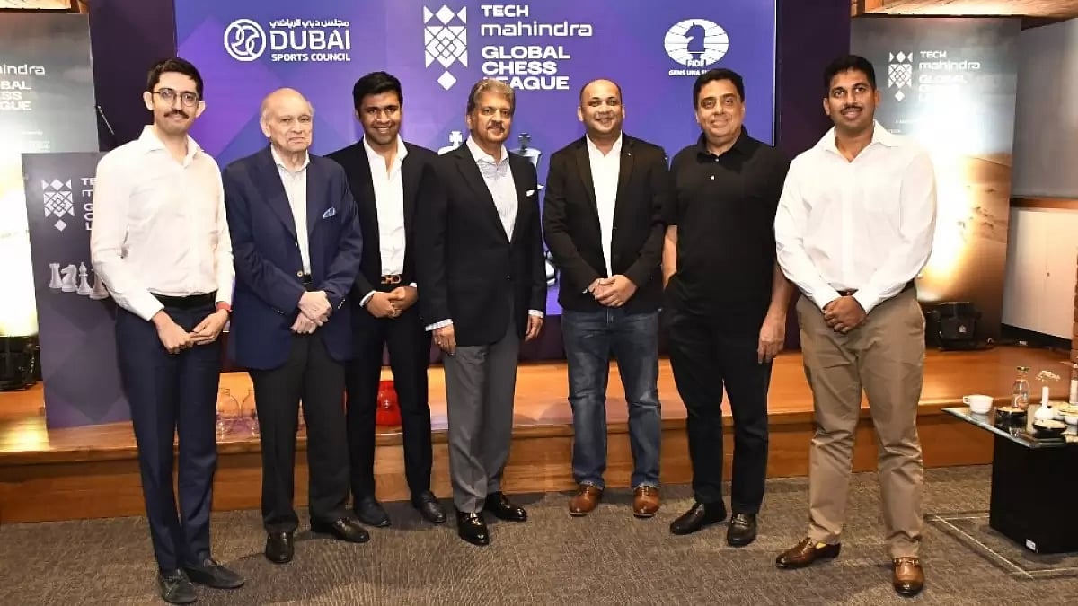 Anand Mahindra, centre, pictured with the GCL team owners.