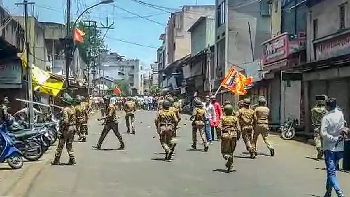 Security personnel disperse agitators objecting to the alleged use of Tipu Sultan’s image