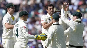 Mitchell Starc and his team-mates celebrate the wicket of Virat Kohli in London on Thursday.
