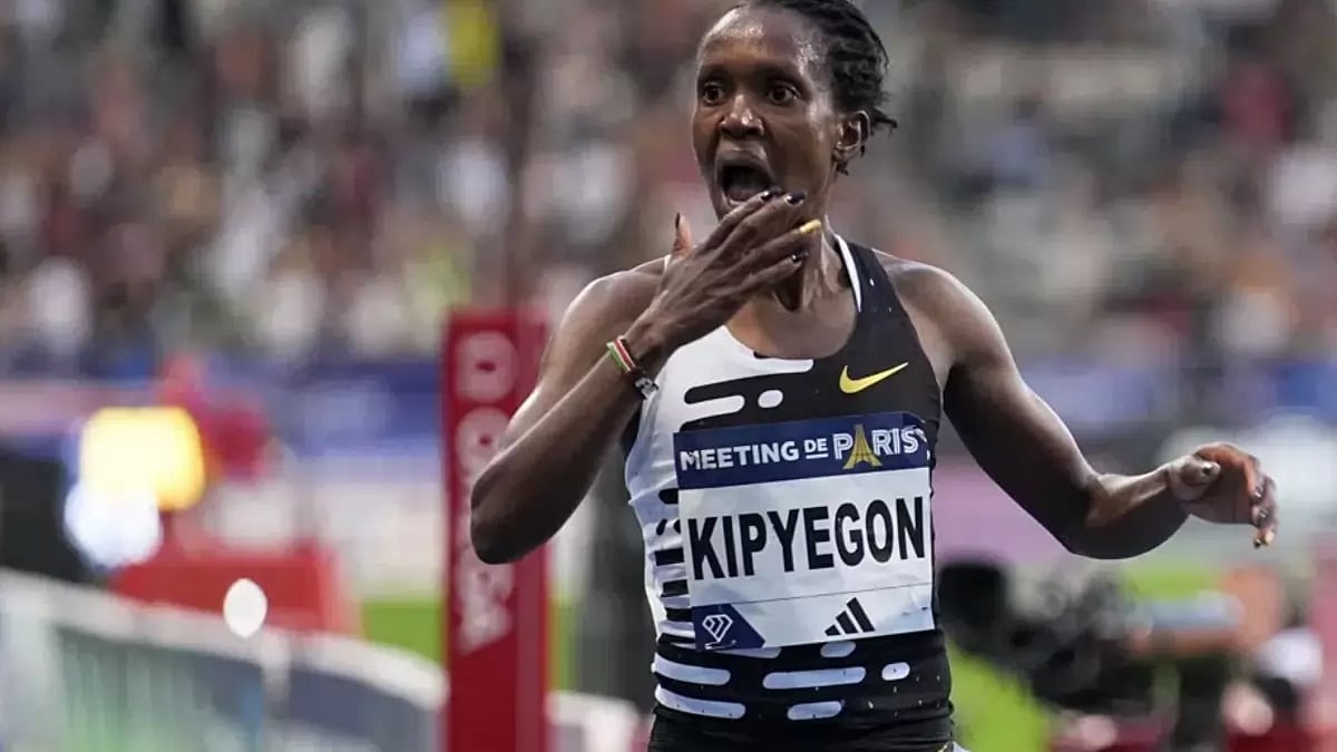 Kipyegon crosses the finish line to win the Women 5000M during the Meeting de Paris Diamond League.