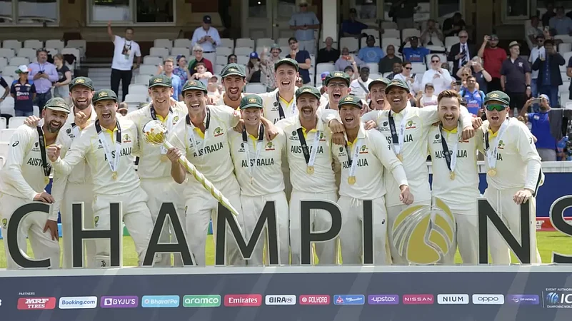 Skipper Pat Cummins holds the ICC mace as his team celebrates