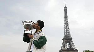 Djokovic kisses his Roland Garros trophy in front of the Eiffel Tower in Paris.