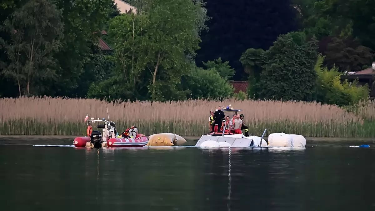 Fire brigade and scuba divers perform recovery operations of the boat on May 29, 2023 in Sesto Calende, Italy. Four people died after a vessel capsized and sank in Lake Maggiore.