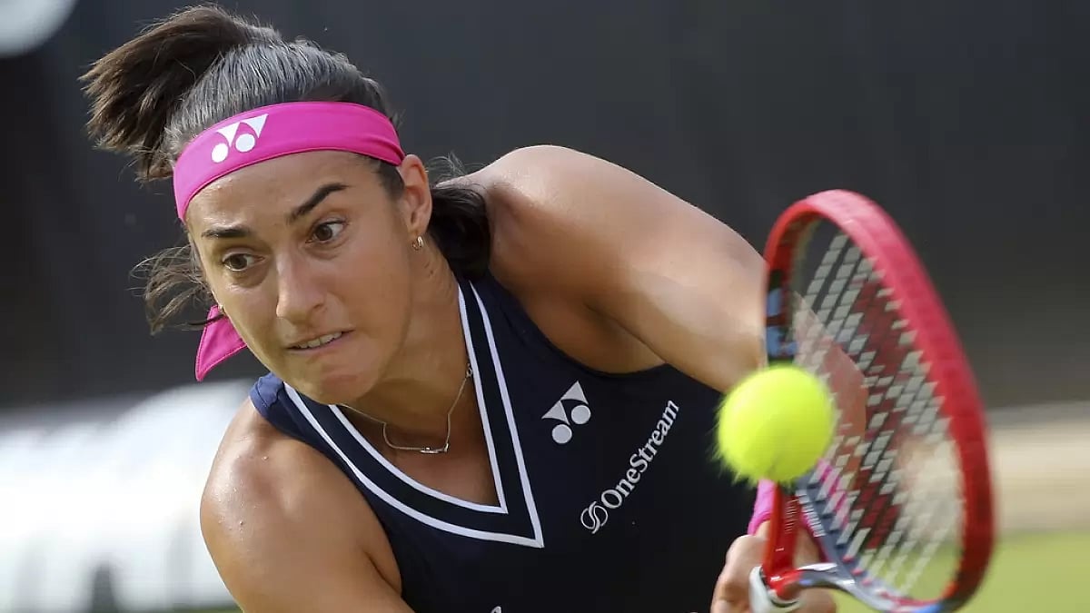 Garcia returns a backhand in her first-round match against Lisicki on Monday.