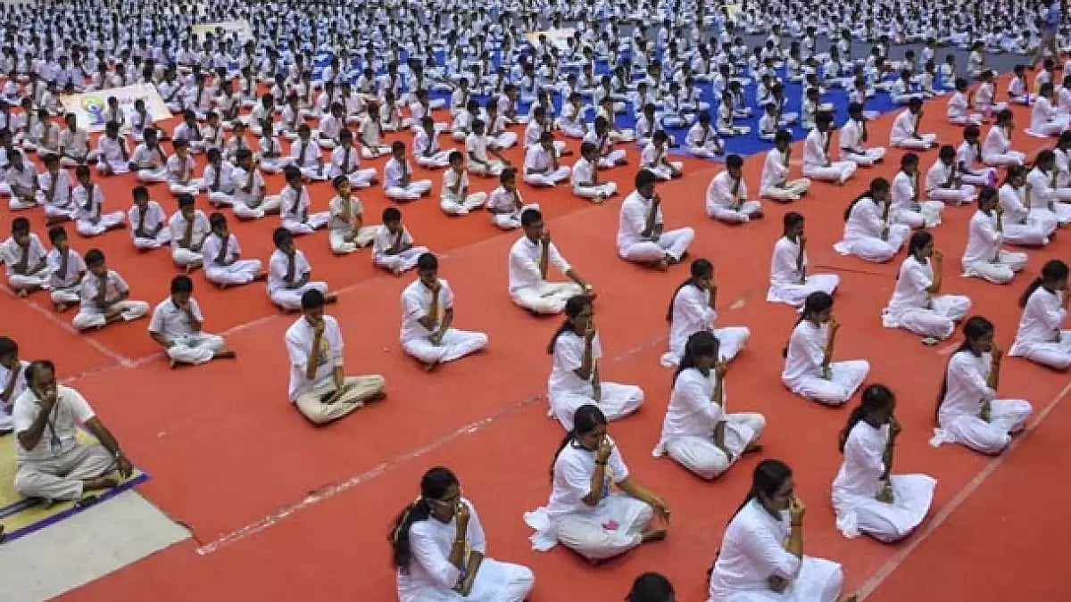 People performing yoga to observe International Yoga Day