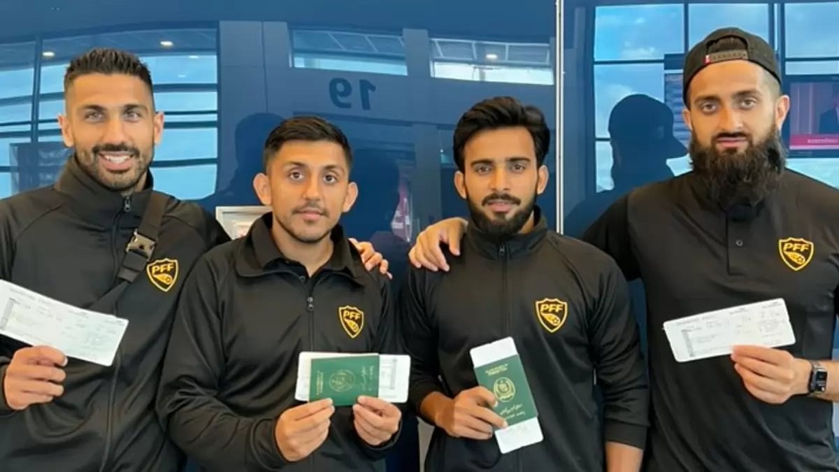 PAK football team players pose with their visas.