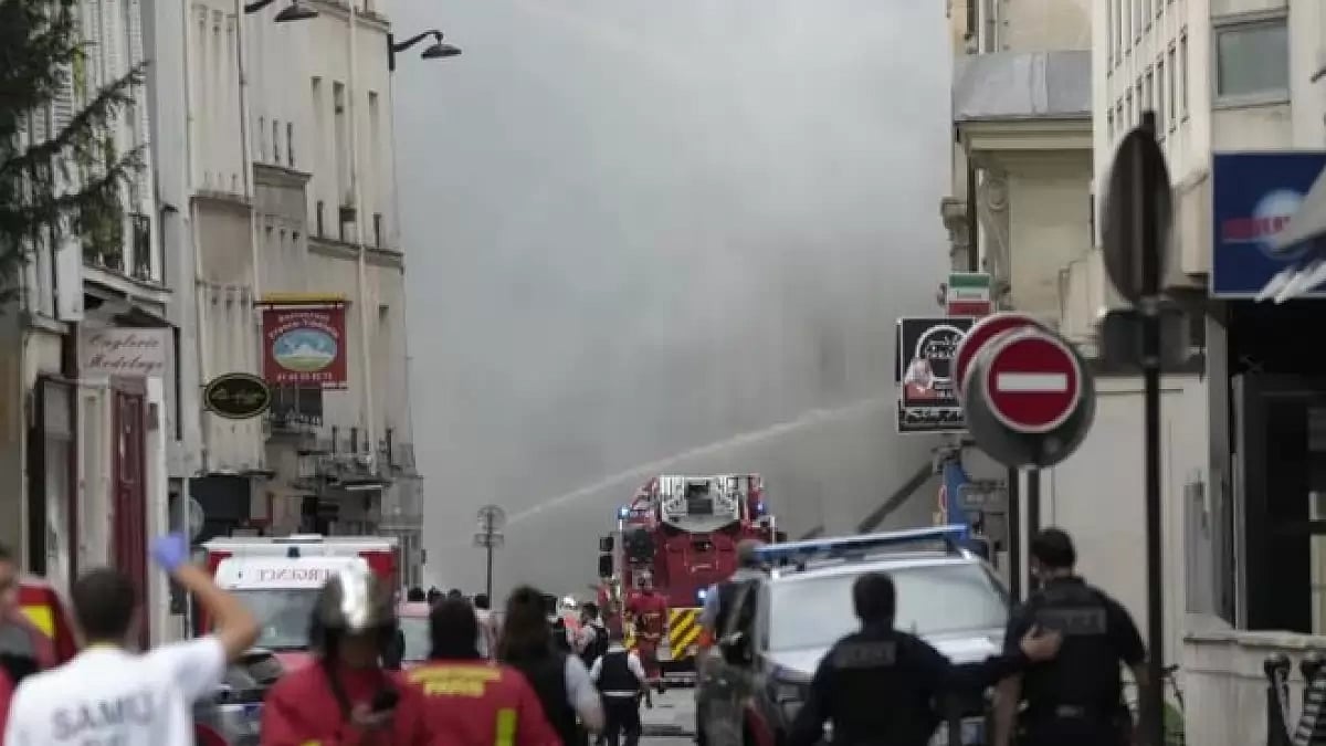 Firemen use a water canon as they fight a blaze Wednesday, June 21, 2023 in Paris